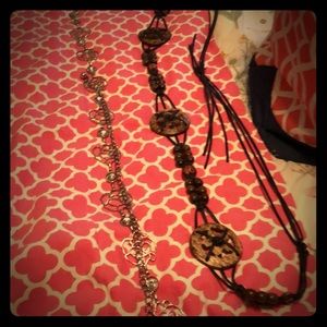 2 belts one is leather and wood the other is a